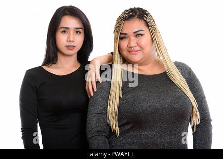 Giovani asiatici transgender donna mano appoggiata sul grasso donna asiatica Foto Stock