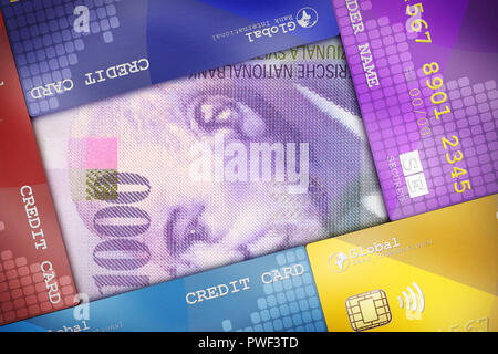 Carte di credito ben disposto a copertura di una bolletta di denaro che simboleggiano i concetti finanziari. Foto Stock