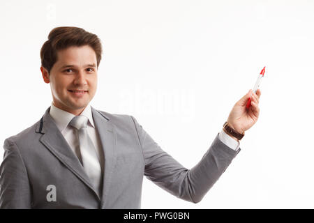 Imprenditore di scrittura o di disegno sullo schermo, di fronte a uno sfondo bianco Foto Stock