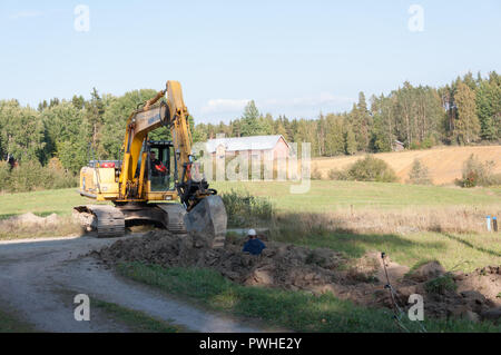 Scavo sotterraneo di posa dei cavi elettrici Foto Stock