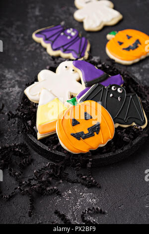 I cookie di Halloween a forma di zucca, bat, ghost e cereali caramellati Foto Stock