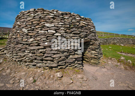 Storico in pietra capanne di alveare, penisola di Dingle, Irlanda Foto Stock