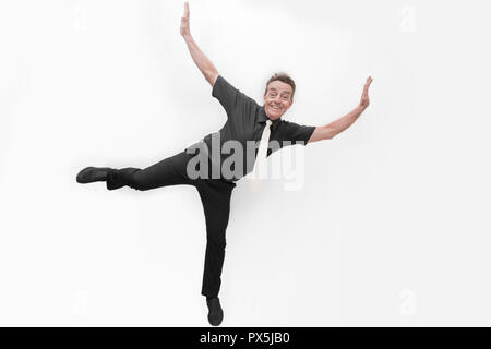 Life Balance pongono concetto fun uomo felice con un grande sorriso denti bianchi la vitalità della scena panno nero su sfondo bianco Foto Stock