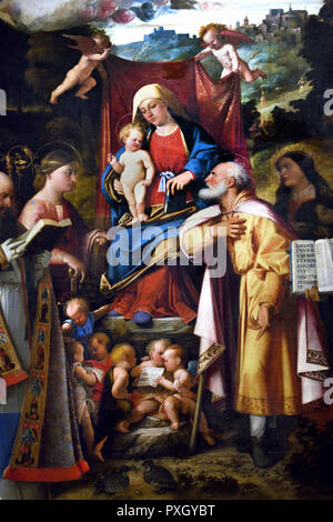 Madonna in trono col Bambino e angeli tra i Santi Apollonia, Agostino, Catherine, Giuseppe, Grata, Filippo Benizzi e Barbara 1517 - 1518 da Cariani (Giovanni Busi) Italia, italiano . Foto Stock