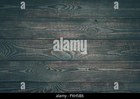 Sfondo della texture di legno pannelli con resti di vernice scura. Orizzontale. Foto Stock