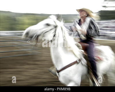 Wetter horsebackriding in Canada Foto Stock