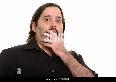 Fat uomo caucasico guardando scioccato con la mano la bocca di copertura Foto Stock