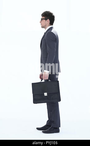 Vista laterale . un fiducioso imprenditore con una cartella in pelle Foto Stock