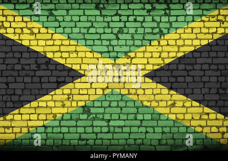 Bandiera della Giamaica è dipinta su un vecchio muro di mattoni Foto Stock