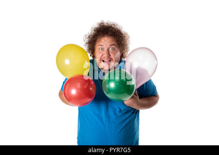 Funny fat man con palloncini. Buon compleanno. Gioia e divertimento Foto Stock