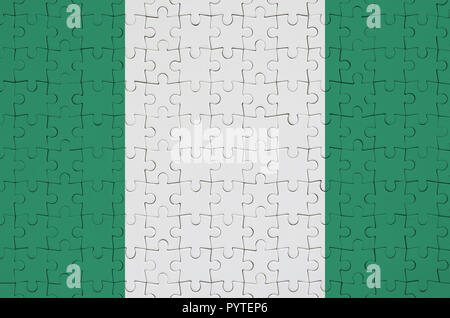 Nigeria bandiera è raffigurato su un puzzle piegato Foto Stock