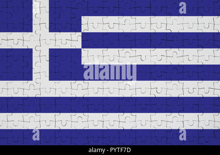 Bandiera della Grecia è raffigurato su un puzzle piegato Foto Stock