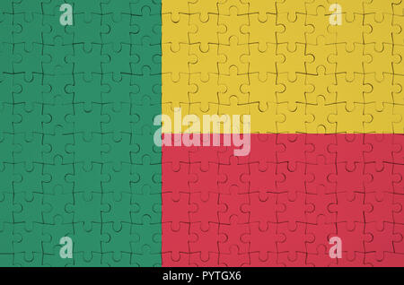 Benin flag è raffigurato su un puzzle piegato Foto Stock