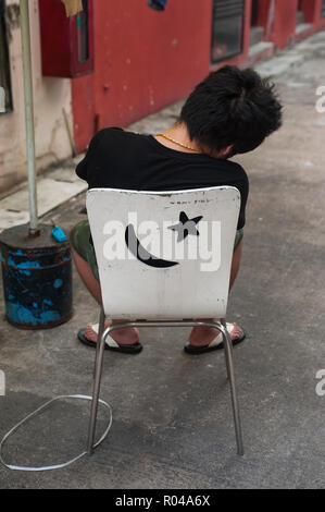 Repubblica di Singapore, uomo dormire a Chinatown Foto Stock