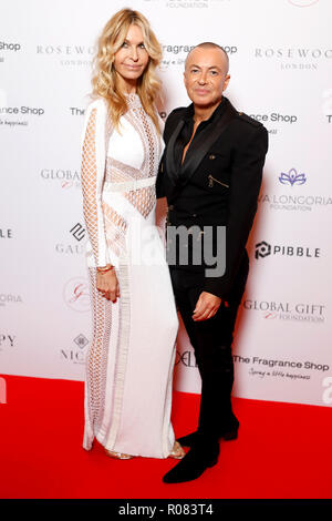 Melissa Odabash e Julien Macdonald che frequentano il nono annuali globali di dono gala tenutosi presso il Rosewood Hotel, Londra. Foto Stock