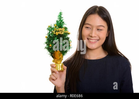 Giovani asiatici felice ragazza sorridente e azienda Happy New Yea Foto Stock