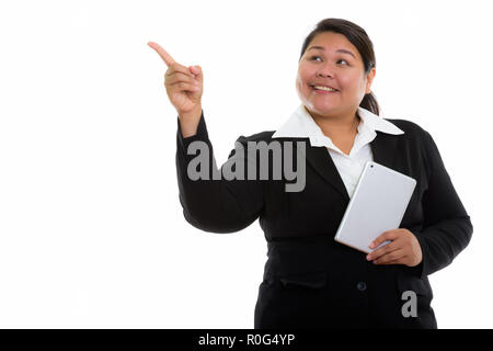 Riflessivo giovani felici fat Asian imprenditrice sorridere mentre hol Foto Stock