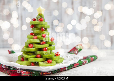 Kiwi melograno albero di Natale, nuovo bellissimo sfondo Anno Foto Stock