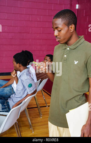 Miami Florida,Overtown,Overtown Youth Center,Summer Career Training Program,Student students teen teens teenager teenagers pubblico,Black male boy Foto Stock