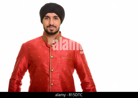 Bel giovane sikh indiana indossando abiti tradizionali Foto Stock