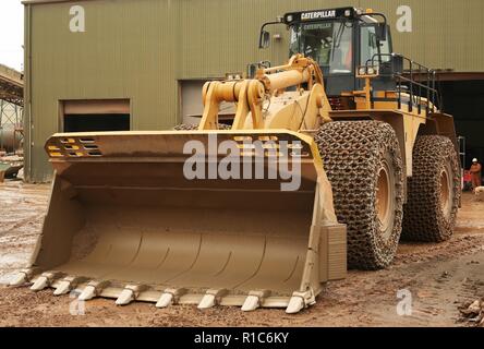 Un gommato Caterpillar pala di carico lavorando in una cava in Leicestershire Foto Stock