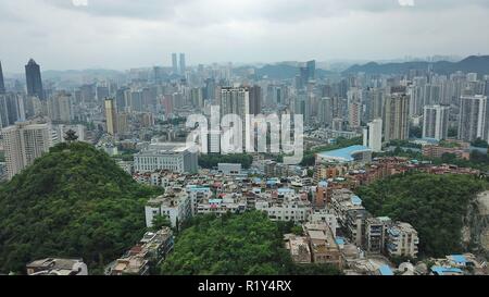 (181115) -- PECHINO, nov. 15, 2018 (Xinhua) -- foto aerea adottate il 23 Maggio 2018 mostra lo scenario di Guiyang, città capitale del sud-ovest della Cina di Guizhou. Secondo una dichiarazione rilasciata dall'Ufficio Nazionale di Statistica (NBS), casa prezzi nelle principali città cinesi è rimasta stabile nel mese di ottobre come i governi locali hanno continuato a tenuta di regolamenti di proprietà. Su un mese su base di mese, nuova casa prezzi in Cina le quattro il primo livello di città - Pechino, Shanghai e Shenzhen e Guangzhou - erano piatti con il mese precedente. Nuova casa prezzi in seconda-tier città aumentati più lentamente il precedente mont Foto Stock