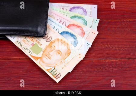 Dollari di Singapore nel portafoglio nero Foto Stock