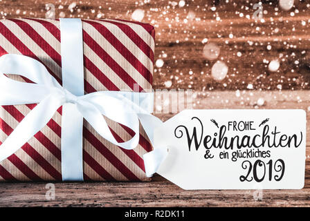 Dono, Tedesco Calligraphy Glueckliches 2019 significa felice 2019, fiocchi di neve Foto Stock