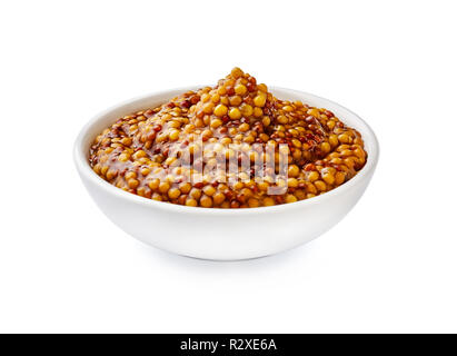 Grano intero senape. Mostarda francese in bianco recipiente isolato. Foto Stock