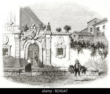 Ingresso ad arco in pietra di un'antica casa a Roma con alcune persone in abbigliamento medievale di fronte. Autore sconosciuto, Magasin Pittoresque 1846. Foto Stock