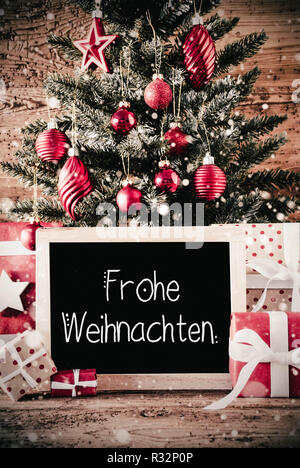 Struttura ad albero verticale, doni, Calligrafia Frohe Weihnachten significa Buon Natale Foto Stock