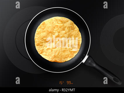 Nero padella con pancake su piastra ad induzione Foto Stock