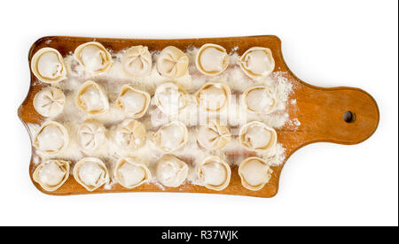 Gnocchi di farina su una tavola di legno. La vista dall'alto. Foto Stock
