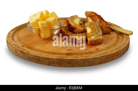 Immagine isolata di caldi toast imburrato, su una tavola di legno. Foto Stock