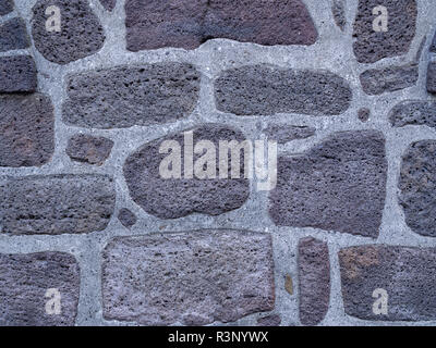 Tipico Ielandic nera vulcanica muro di mattoni di sfondo (texyure) Foto Stock