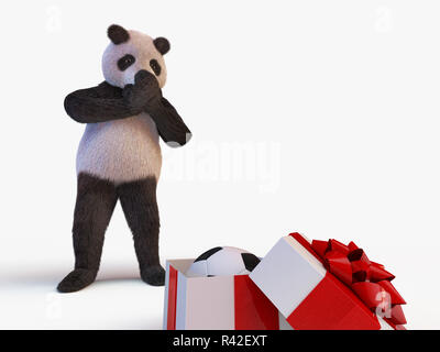 Gioiosa simpatico personaggio protagonista del panda gigante gabbie di bambù e guarda la semi-scatola aperta con un regalo all'interno dei quali è il nuovo Pallone da calcio. sorpresa di compleanno muso chiude zampe Foto Stock