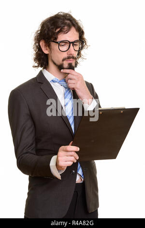 Bello imprenditore caucasico negli appunti di lettura mentre il pensiero Foto Stock