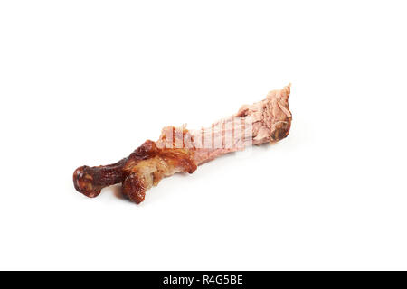 Osso di pollo dopo aver mangiato , isolato su uno sfondo bianco. Foto Stock