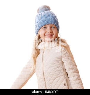 Bambina in maglia blu cappuccio con pompon in pelliccia e giacca beige.isolati su sfondo bianco Foto Stock