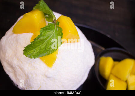 Mango con ghiaccio rasato il sapore del latte Foto Stock