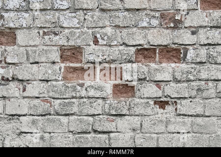 Un muro di mattoni la texture sbucciato con il battuto di mattoni Foto Stock