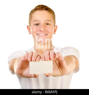 Ragazzo adolescente tenendo la scheda vuota Foto Stock