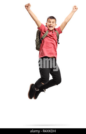 A piena lunghezza ritratto di un felice ed emozionato teenage schoolboy jumping isolati su sfondo bianco Foto Stock