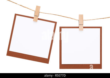 Blank Foto istantanea appeso sulla corda con clothespin Foto Stock
