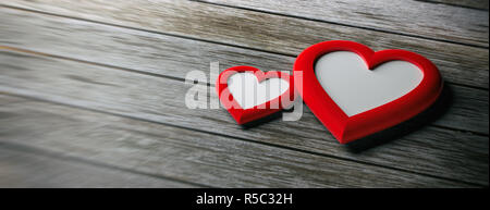 Il giorno di San Valentino, il concetto di amore. Due rosso a forma di cuore cornici vuote su sfondo di legno, banner, spazio di copia Foto Stock