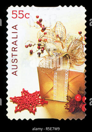 AUSTRALIA - circa 2011: un usato francobollo da Australia, raffigurante una illustrazione di doni e regali, celebrando il Natale, circa 2011. Foto Stock