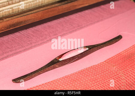 Navetta per la tessitura in ordito Foto Stock