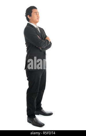 Vista laterale Asian businessman bracci ripiegati Foto Stock