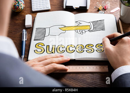 Il relè Baton e concetto di successo Foto Stock