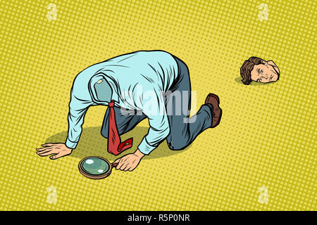 L'uomo ha perso la sua testa. Guardando con una lente di ingrandimento Foto Stock